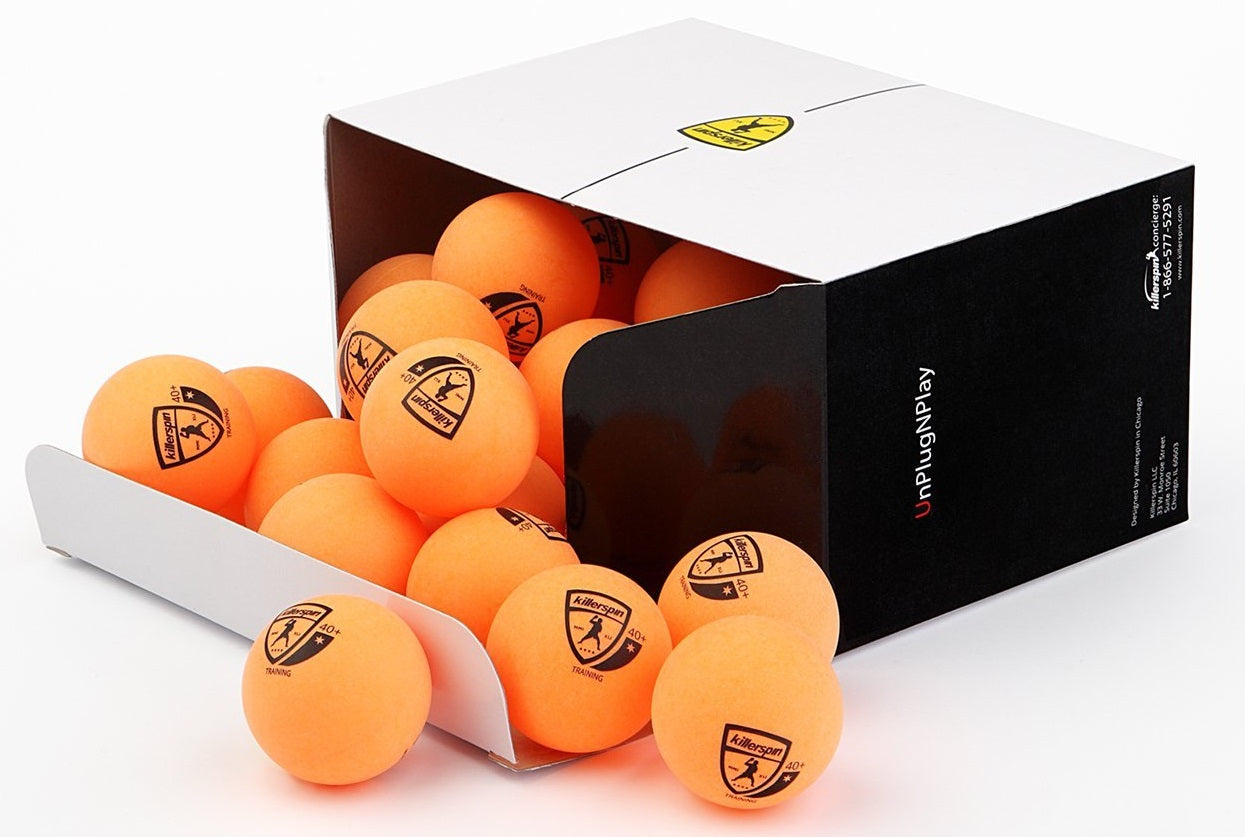 Orange Colored Ping Pong Balls In An Open Box.